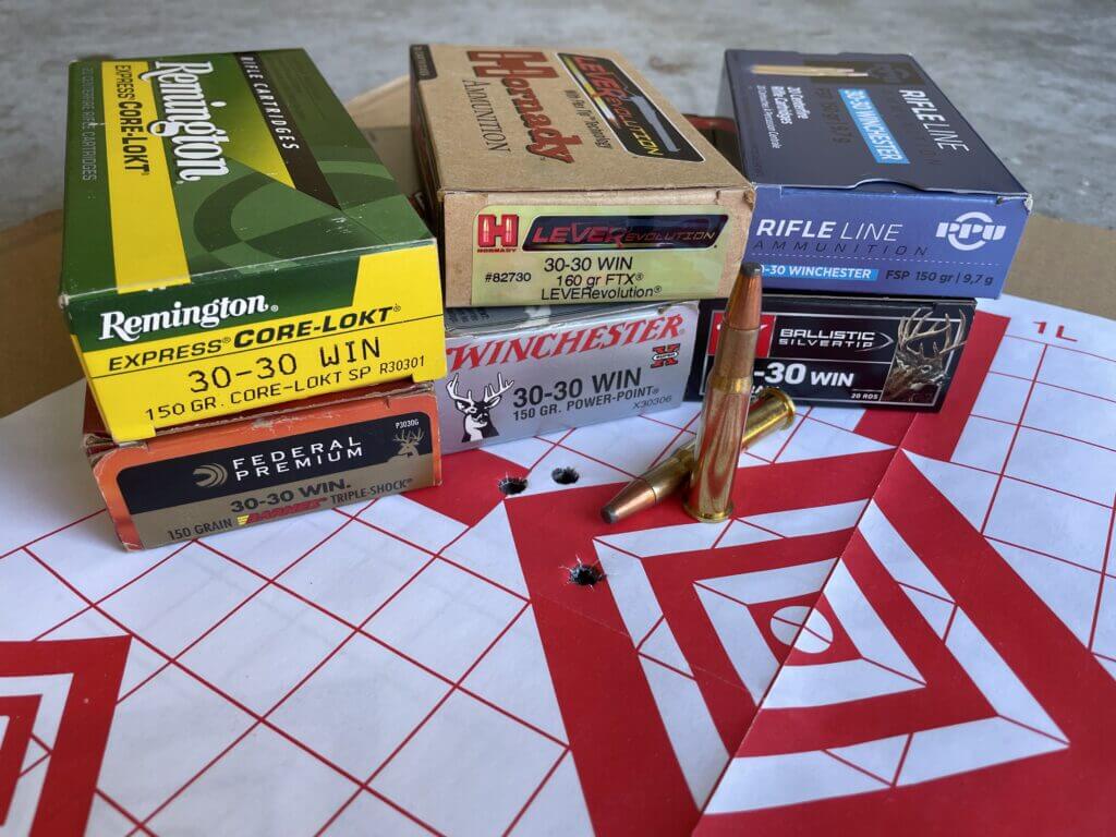Assorted .30 30 Winchester ammunition options next to Model 94