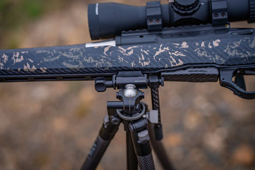 Ridge Warden head in ball mode leveling a rifle on uneven terrain with sideways ARCA rail