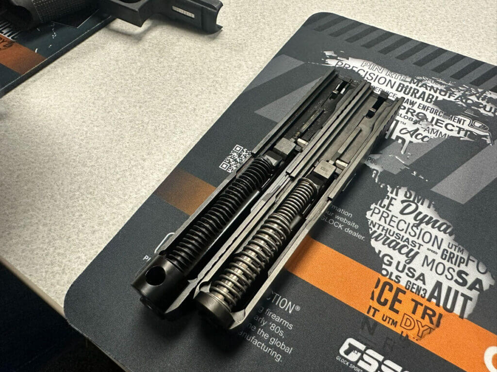 Glock Gen 6 single captured recoil spring compared to Gen 5 dual spring side by side