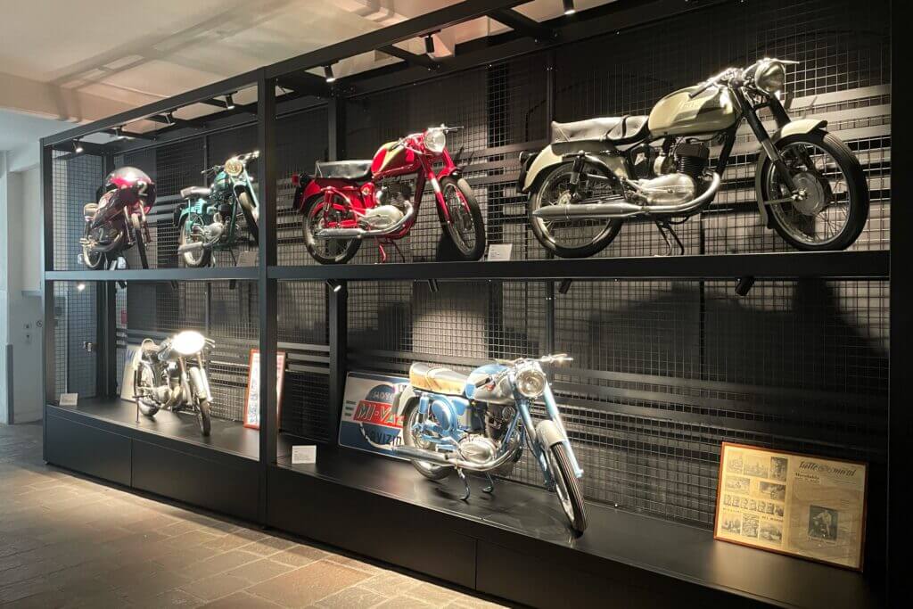 Restored vintage Beretta motorcycles displayed at headquarters
