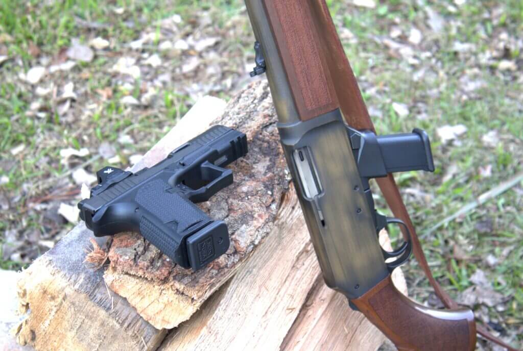 Henry Homesteader M-LOK with optional Glock magazine well beside Glock pistol