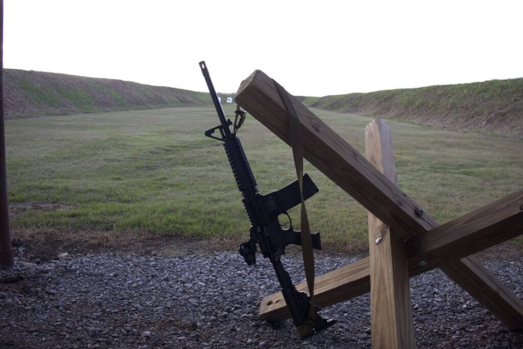 Smith and Wesson M&P Sport II mounted with Primary Arms SLx 3x prism sight at the shooting line