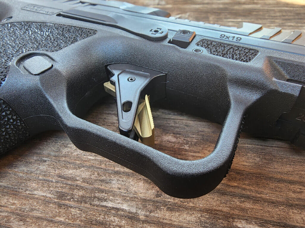 close up pistol trigger used handgun inspection trigger reset check