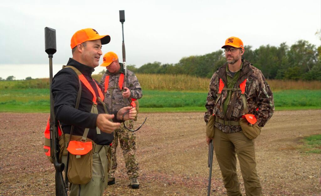 Group in camo and orange at the 20th Anniversary Pheasant Hunt