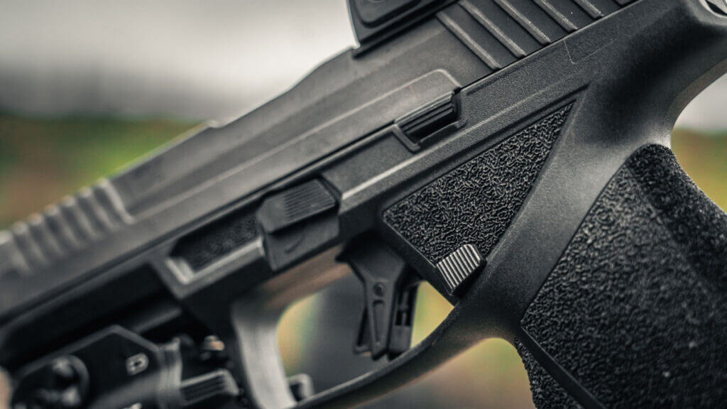 Taurus TX9 controls showing ambidextrous slide release and magazine release