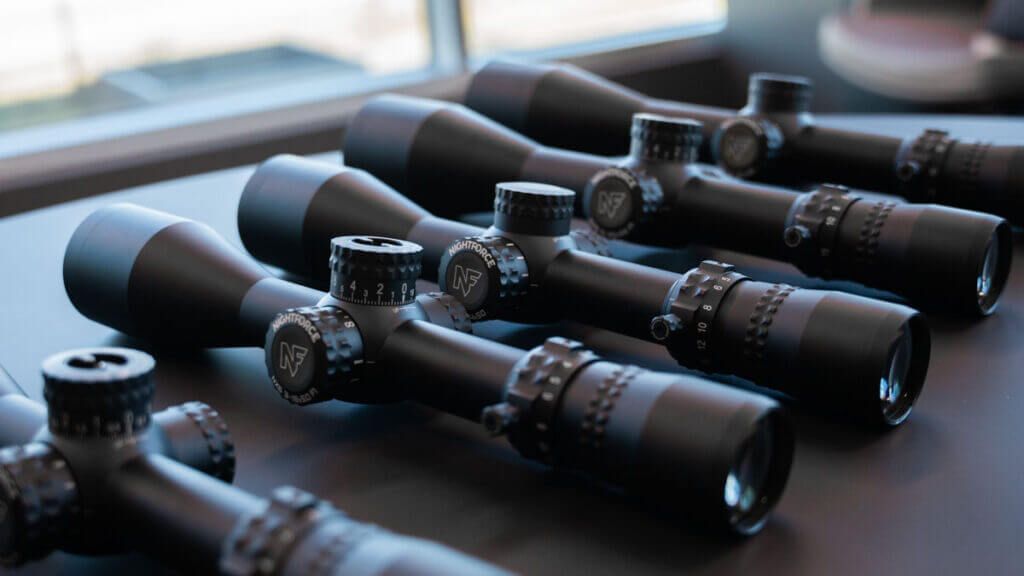 Nightforce NX6 riflescope family on display with turrets and magnification rings visible