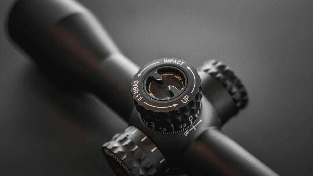 Close view of Nightforce FieldSet turret system showing zero reset and stop configuration