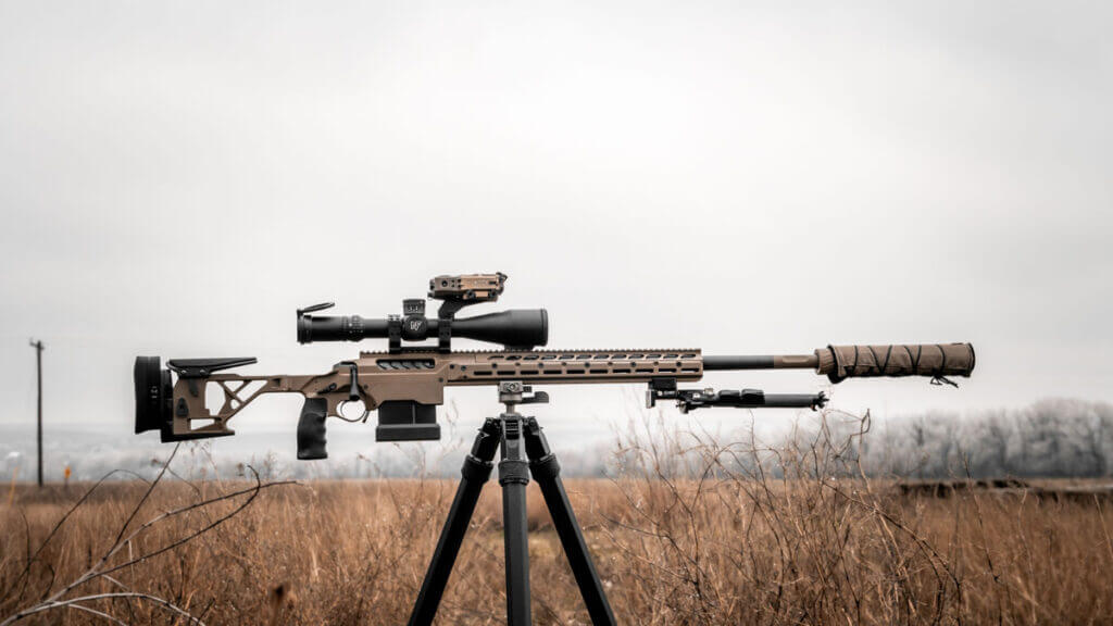 Seekins Precision SIC rifle in FDE on the line with optics and suppressor, field-ready precision setup