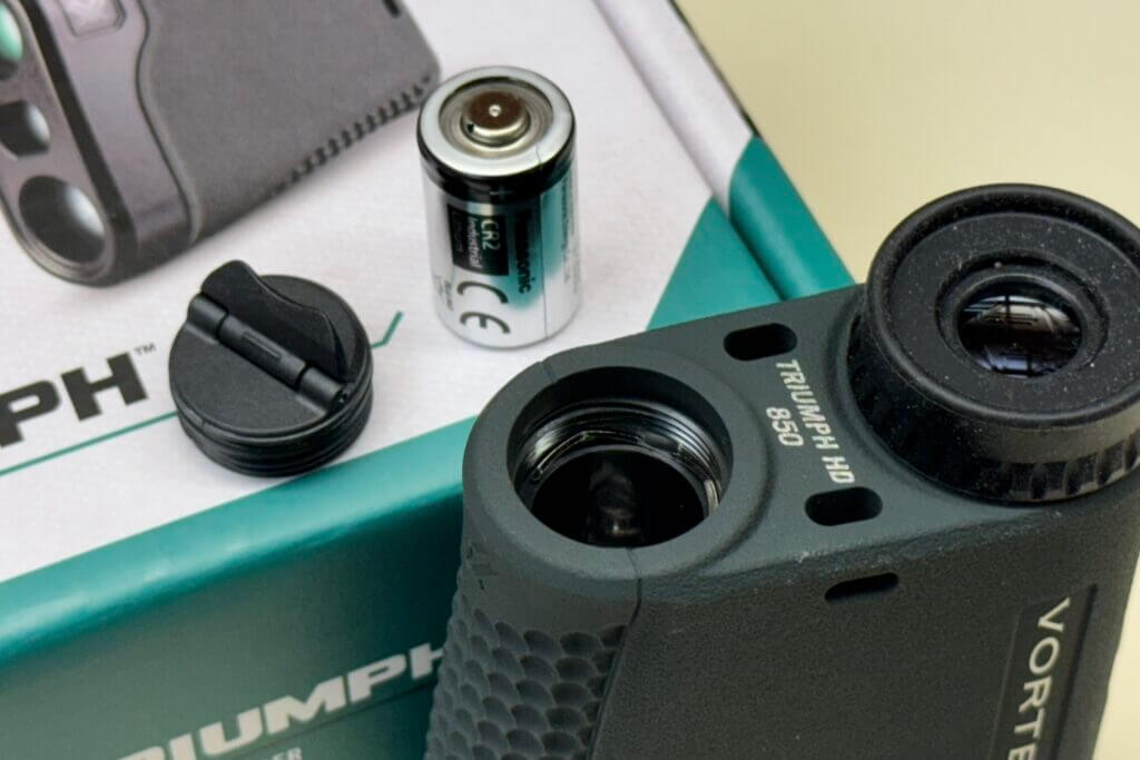 Battery compartment of the Vortex Triumph HD 850 showing CR2 battery power source