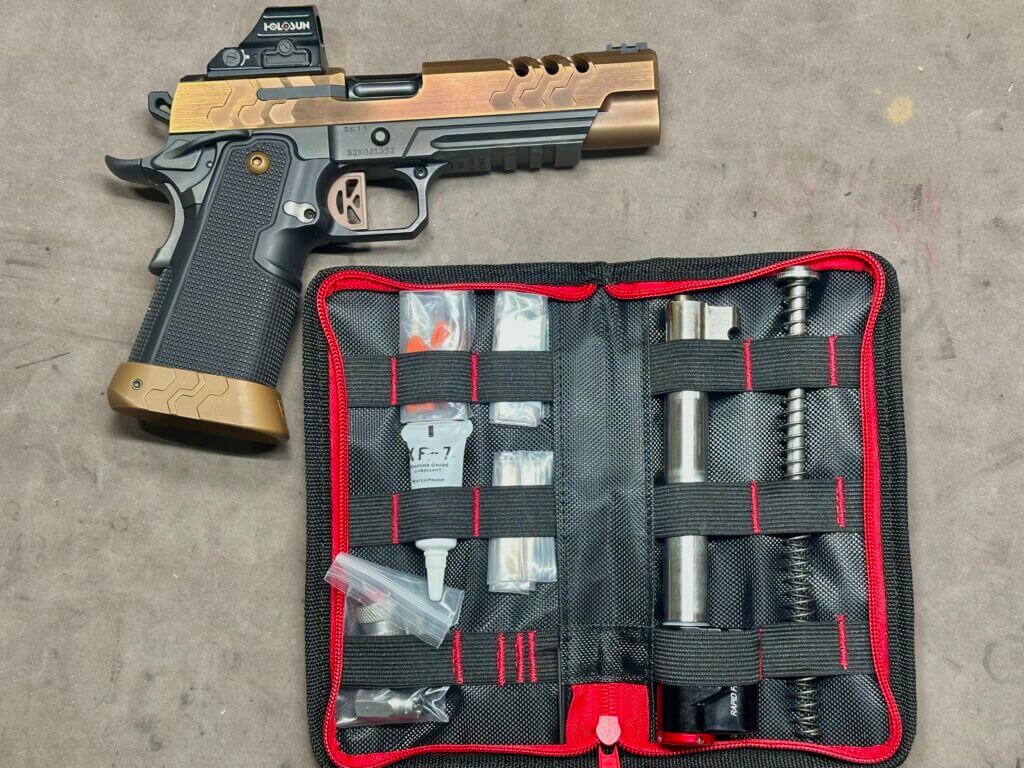 Kimber 2K11 beside 2011 Bull Barrel CoolFire Trainer kit on range bench