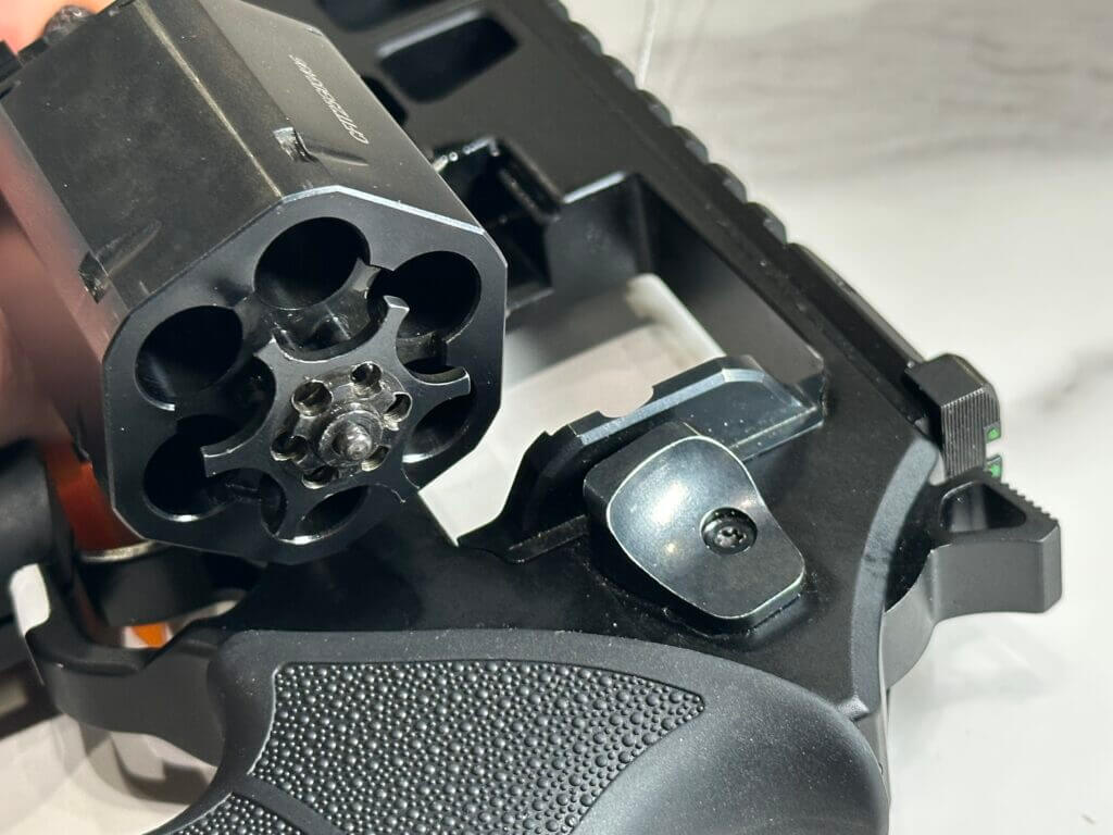 Closeup view of the cylinder and ejector of the Chiappa Rhino 44 Magnum.