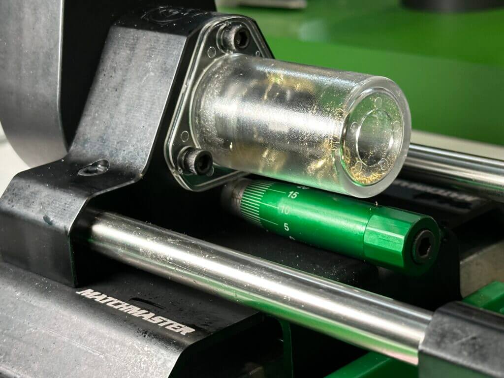 Closeup view of the micrometer stop and cutter head on a case trimmer.