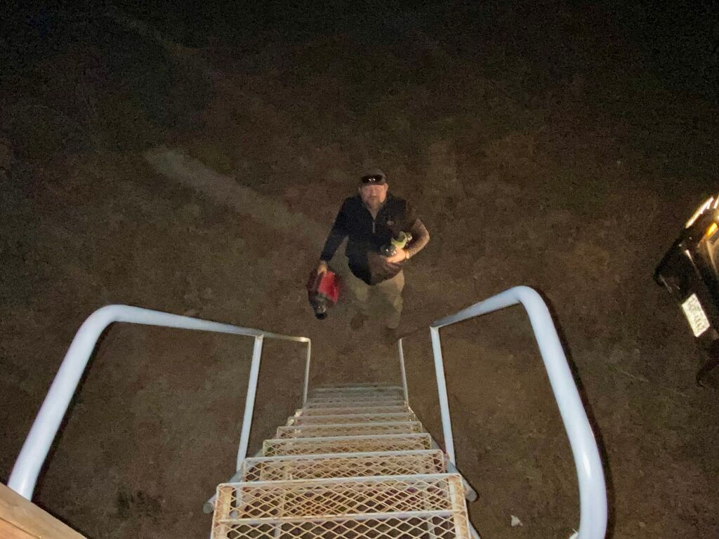 Dinner and propane heater delivered to hunting stand during West Texas night hunt with thermal optics