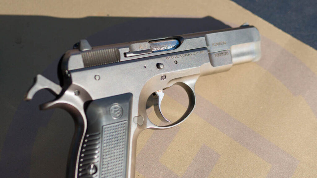 The right side of the gun with the hammer cocked.