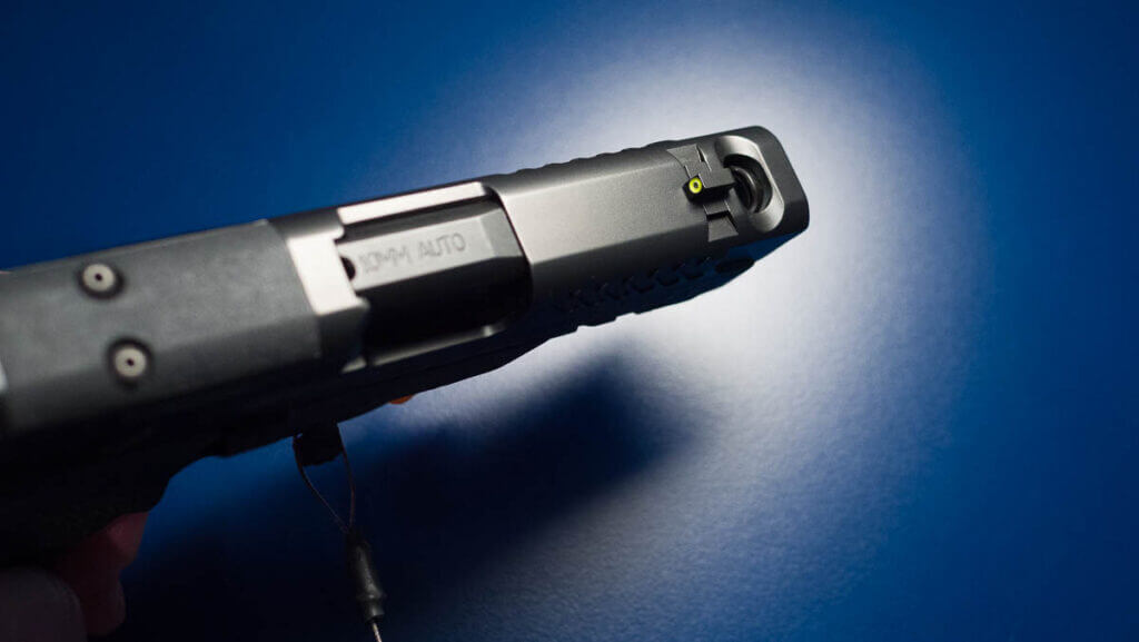 Front top view of the slide showing the front sight and the port.