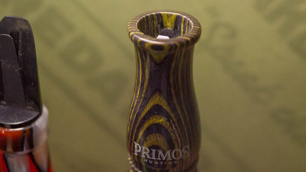 close up view of the mouthpiece of a laminate wood call.