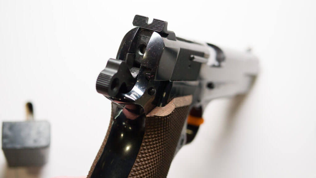Close up view of the back of the slide with the hammer cocked.
