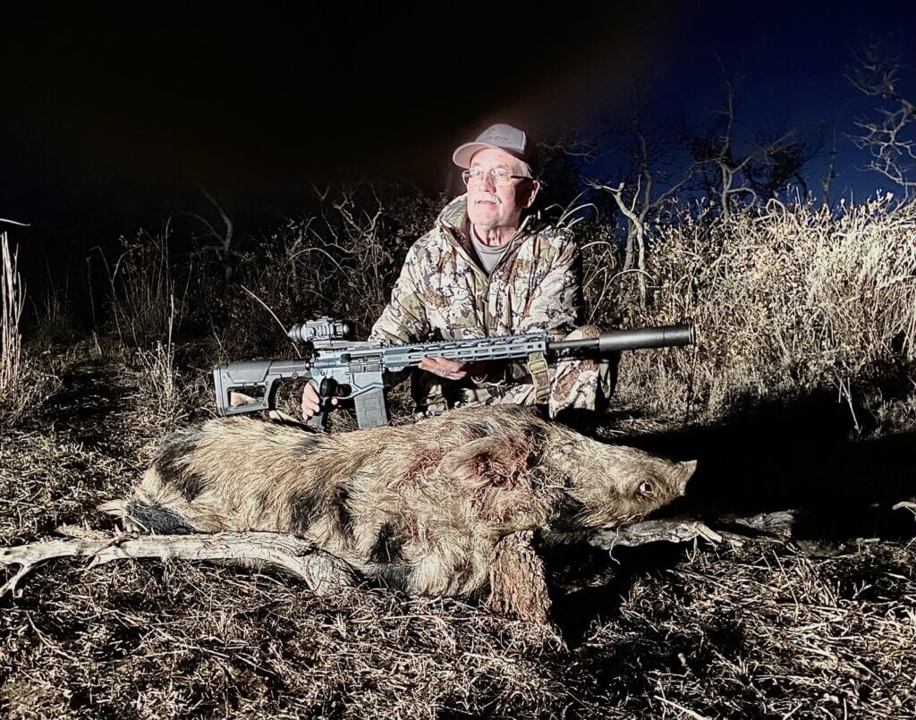 Brian McCombie with boar taken at The Tornado stand using Armasight Commander 640 thermal sight in Texas