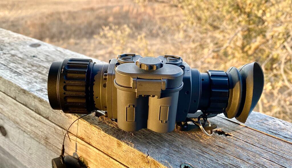 Armasight Warden 640 2-8x35 thermal monocular in use scanning field at night for hogs in Texas