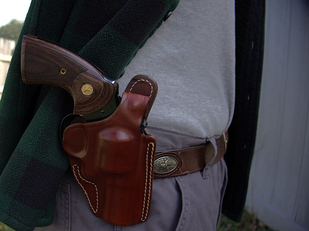 blued Colt Python 3-inch revolver in a Craft Belt Side leather holster