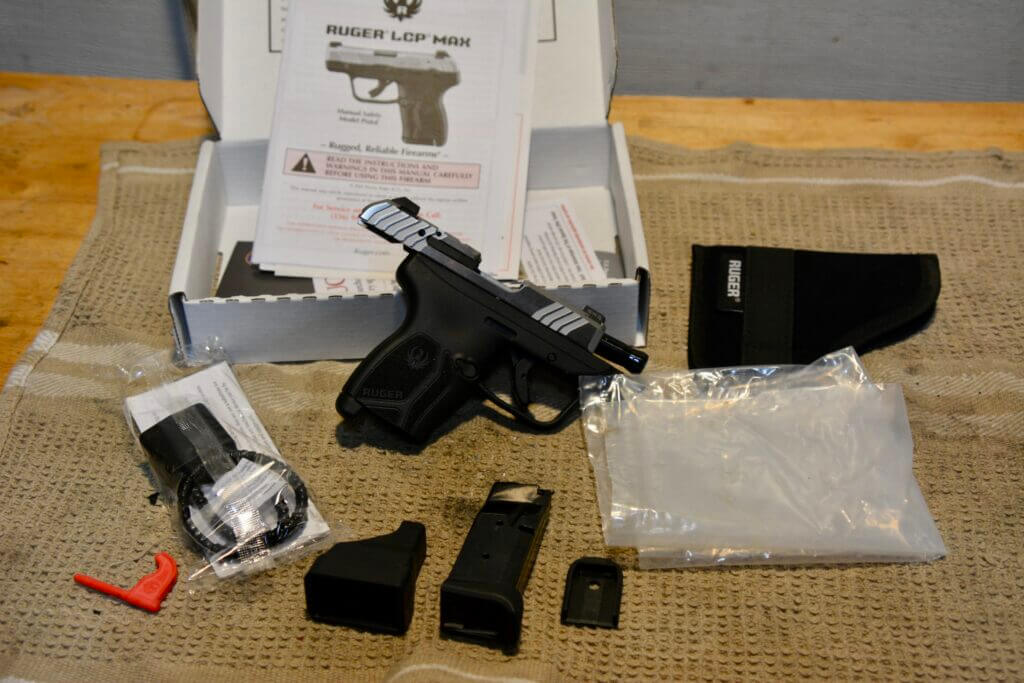Ruger LCP Max box contents with pistol magazine pocket holster mag loader lock and paperwork