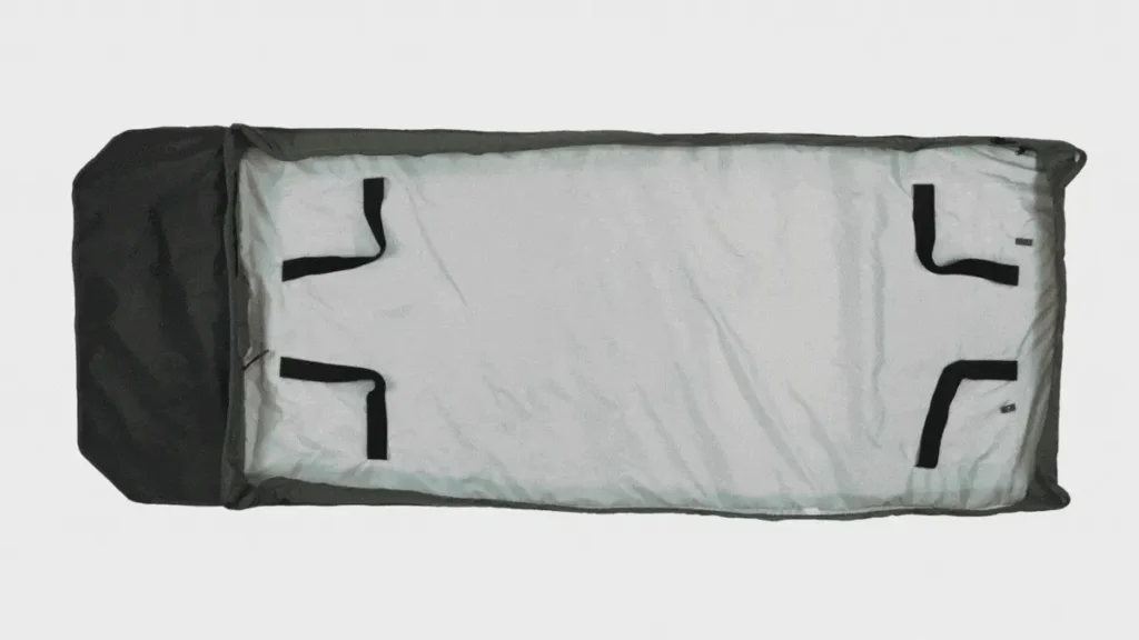 animation of the bedroll being made like a bed with sheets and blankets.