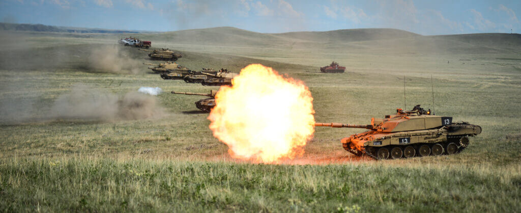 Challenger 2 tank firing during urban breaching demonstration echoing British assault tactics in Basra