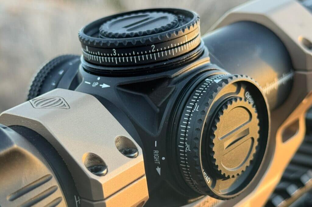 Close-up of Vortex AMG 1-10x24 split turret rings for dual-zero system