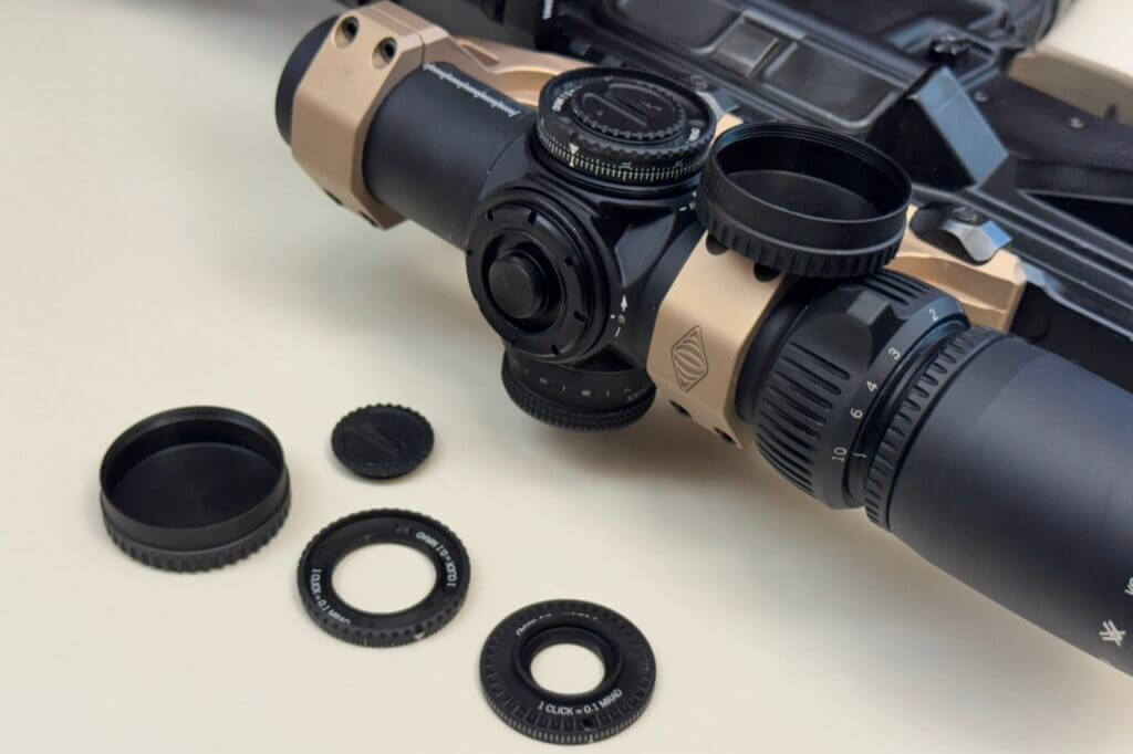 Elevation and windage turrets on Vortex AMG 1-10x24 showing split rings for dual mechanical zeros