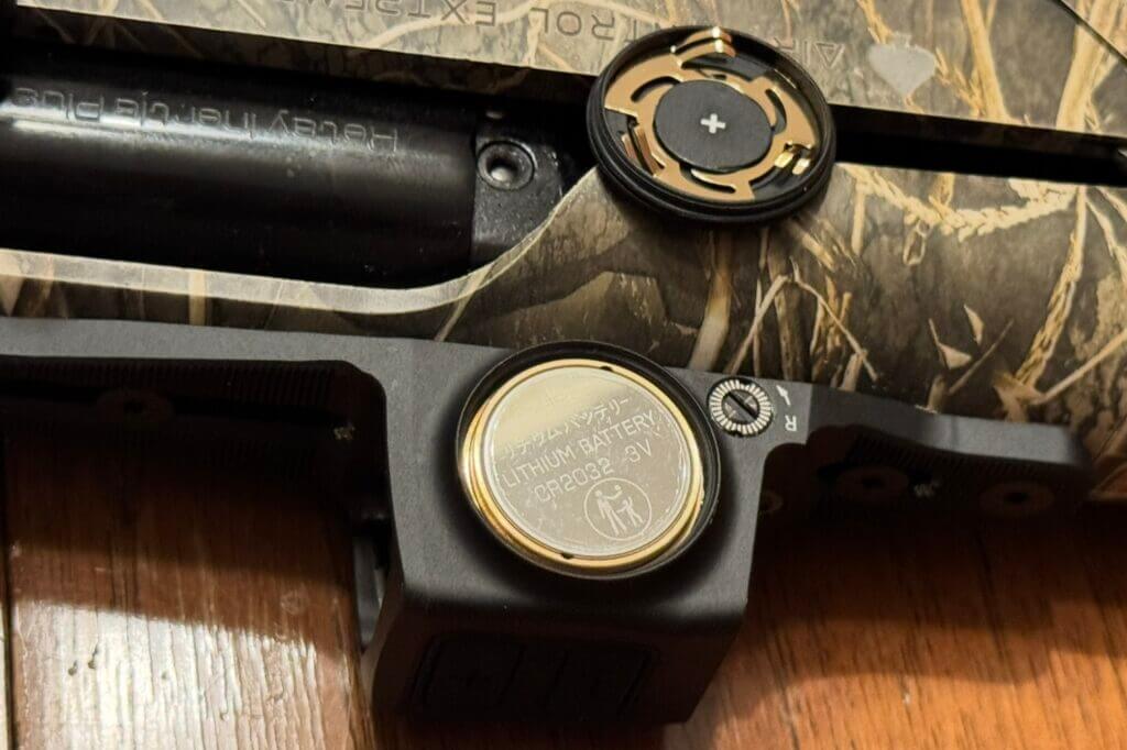 Side-loading CR2032 battery compartment on Vortex Viper Shotgun Enclosed Micro Green Dot housing