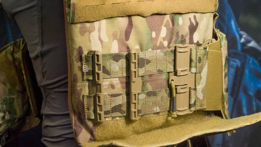 The back of the vest with the left side detached to show the expansion set.