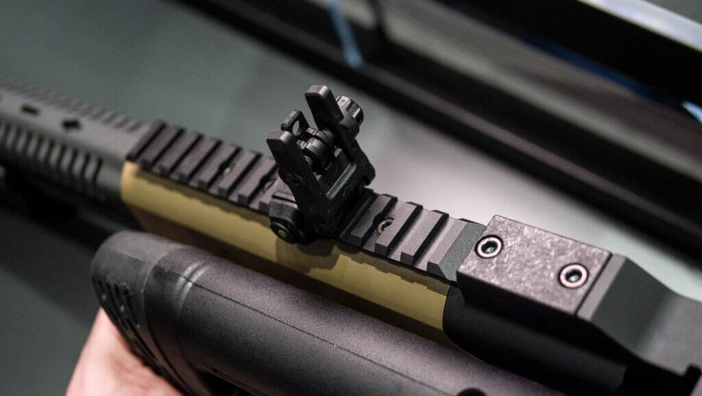 Close up view of the top rail with sights popped up.