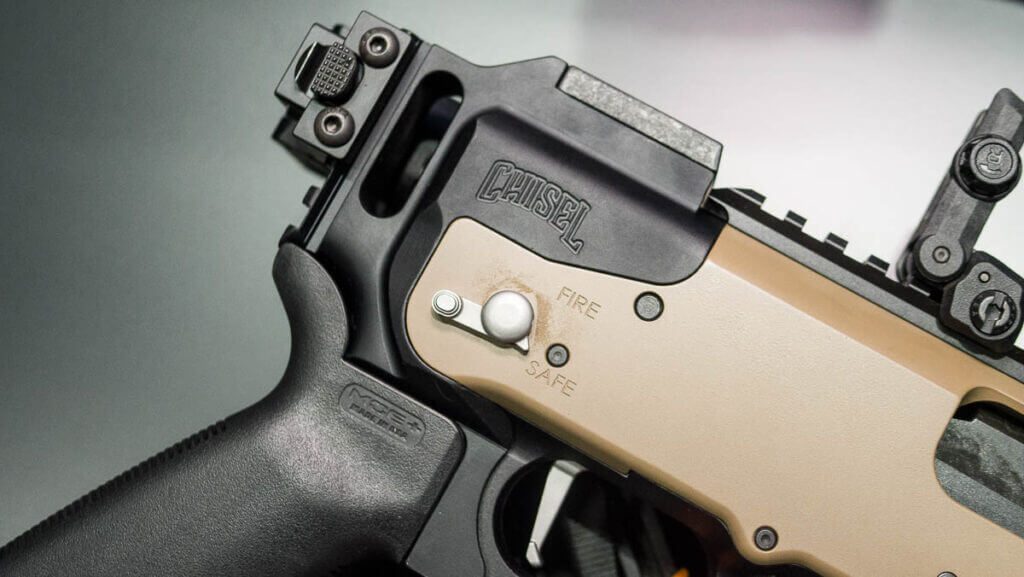 Close up view of the right side of the receiver with the stock folded.