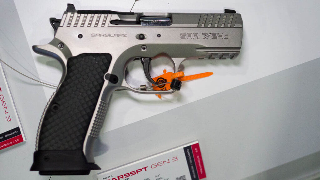 the whole gun in the carry size laying on a table.