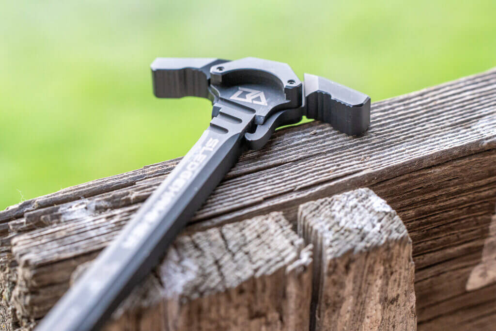 Breek Arms Sledgehammer charging handle flutes that redirect suppressor gas to the right side of the AR-15