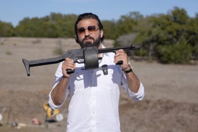 AK Guy holds up the Striker-12 shotgun.