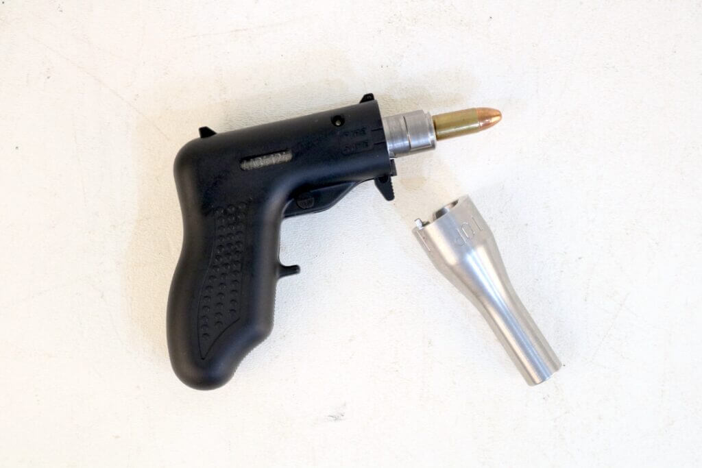 Action of the Altor 9mm single-shot pistol with barrel removed to show its simple operating system