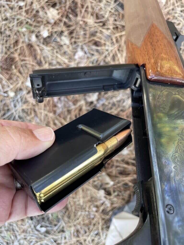 Detachable Browning BAR magazine removed from trap door floor plate