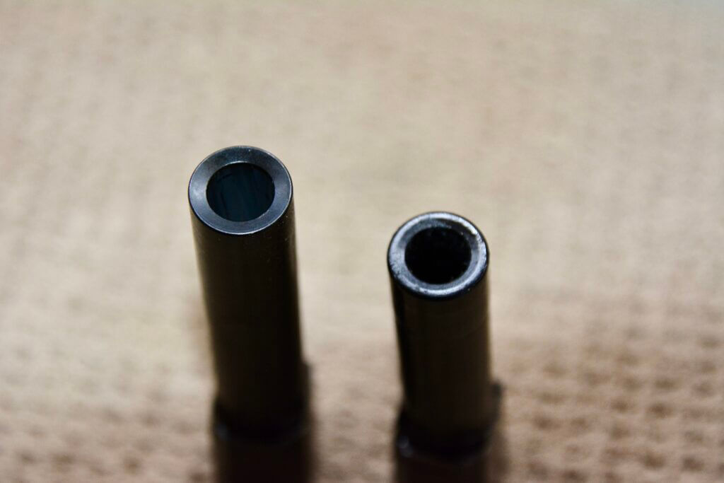 Smith & Wesson M&P Shield X barrel on left compared beside Shield Plus barrel on right