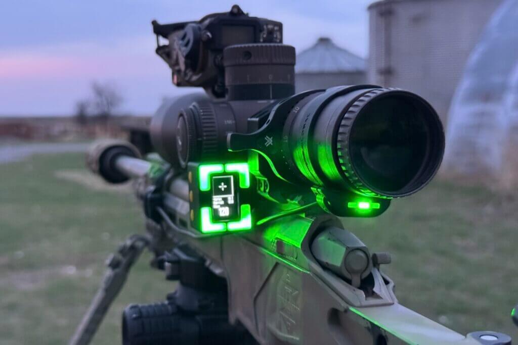 Shooters Global Pulse Pro ocular LED display attached to a rifle scope with a rubber strap
