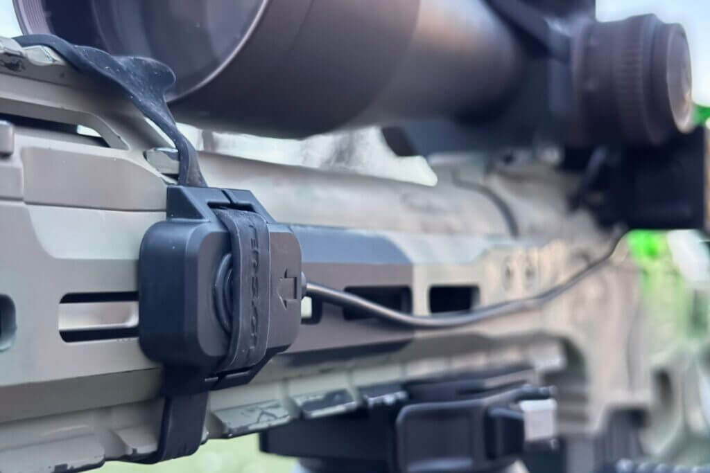 Shooters Global Pulse Pro remote control button mounted to a handguard with a rubber strap