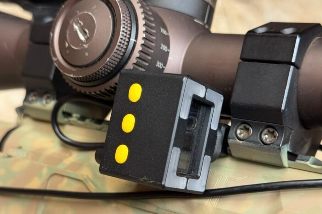 Side view of the Shooters Global Pulse Pro housing showing the three control buttons
