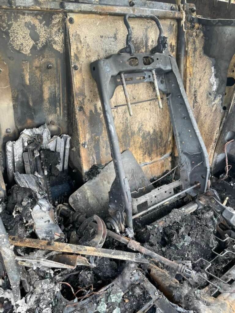 The destroyed interior of a Houston Police patrol vehicle after a pursuit crash and fire.