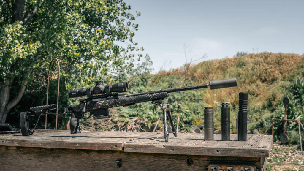 Airlock Zero Gravity 6.5 suppressor mounted on Seekins Element Hunter beside SilencerCo Scythe Ti and Omega 300