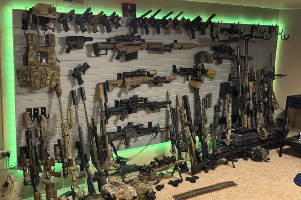 Fully loaded Hold Up Displays Gun Wall holding rifles pistols helmet plate carrier and magazine holders