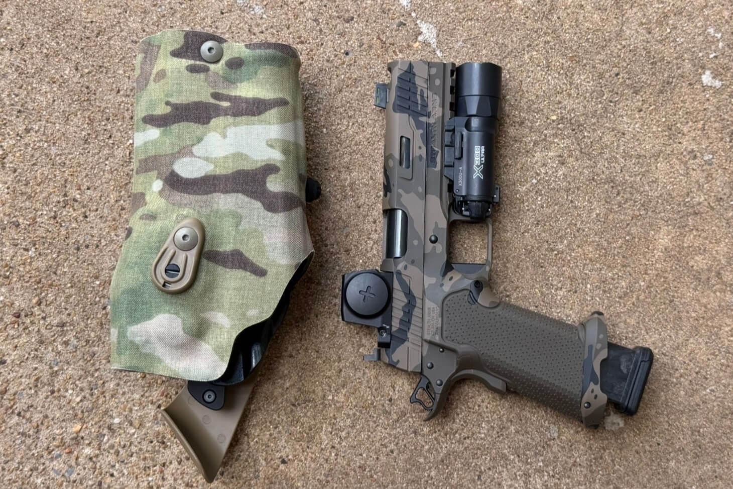 Staccato XC 2011 pistol with weapon light next to a Safariland duty holster