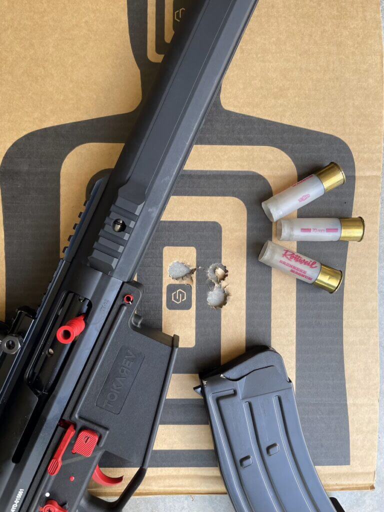 Tokarev TT 12 Pro slug accuracy target with 1.5-inch 3-shot groups at 25 yards