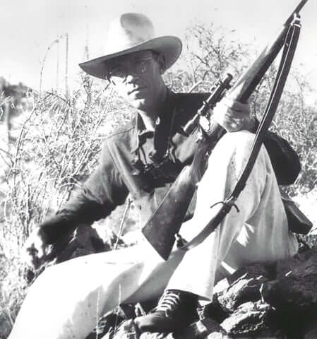 Jack O'Connor holding a Winchester Model 70 rifle in .270 Winchester