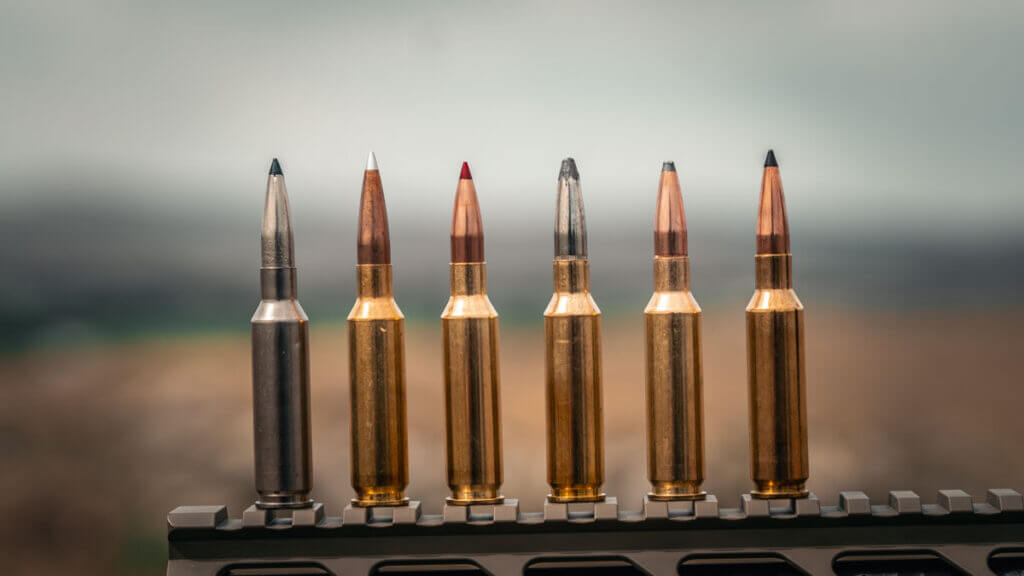 Federal 6.5 Creedmoor +Peak steel case ammunition beside traditional brass 6.5 Creedmoor cartridges