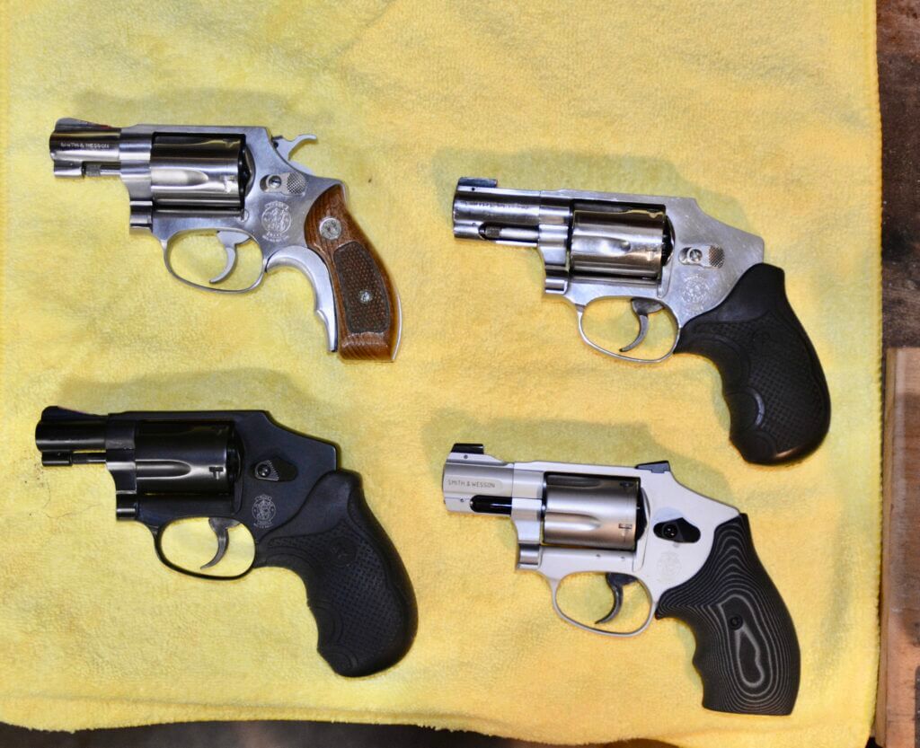 Smith and Wesson J-Frame revolvers staged for concealed carry evaluation